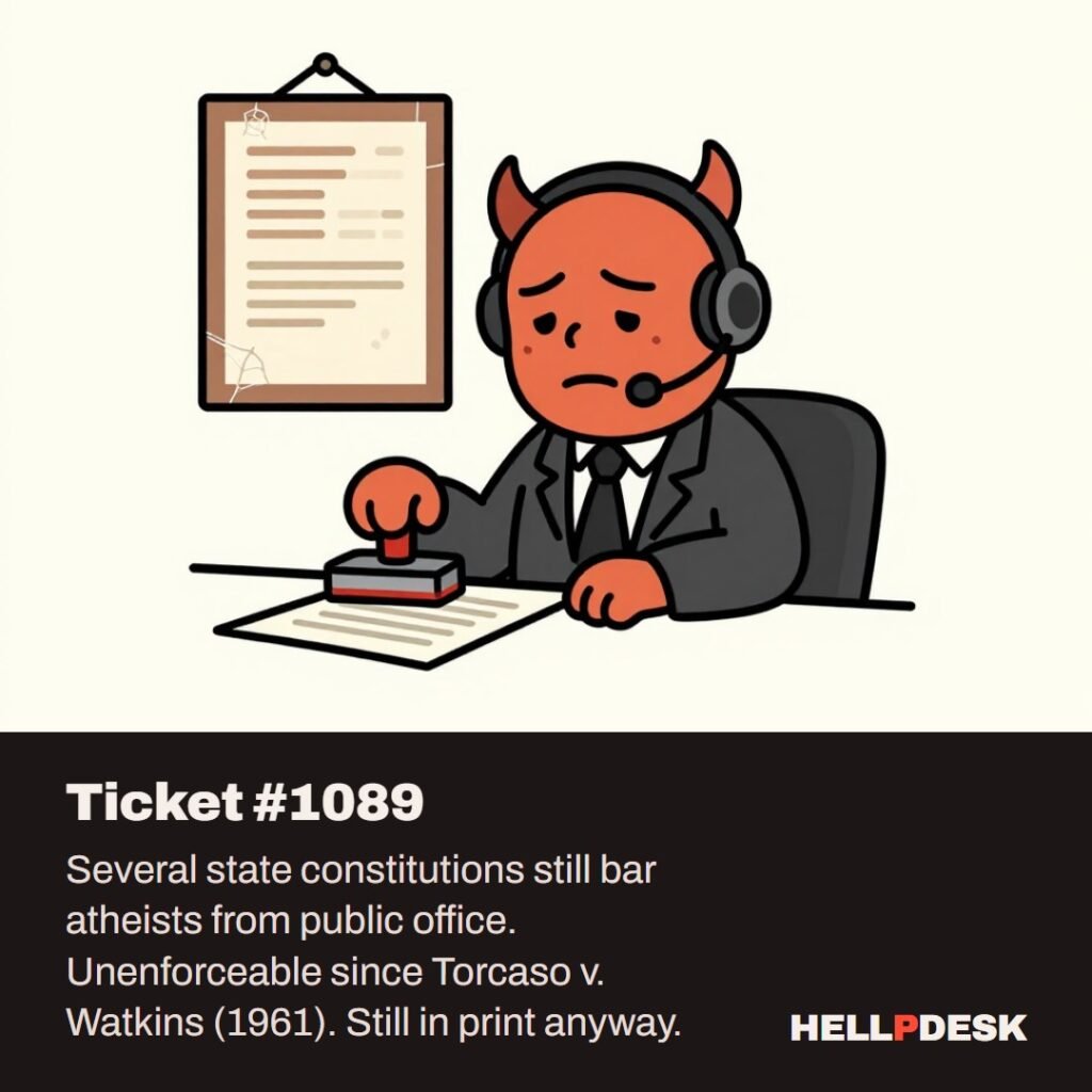 Cartoon illustration: A tired cartoon demon in a headset sits at a support desk holding a big rubber stamp over a form, while behind him a dusty old framed document hangs crookedly on the wall, covered in cobwebs. Caption: Ticket #1089. Several state constitutions still bar atheists from public office. Unenforceable since Torcaso v. Watkins (1961). Still in print anyway.